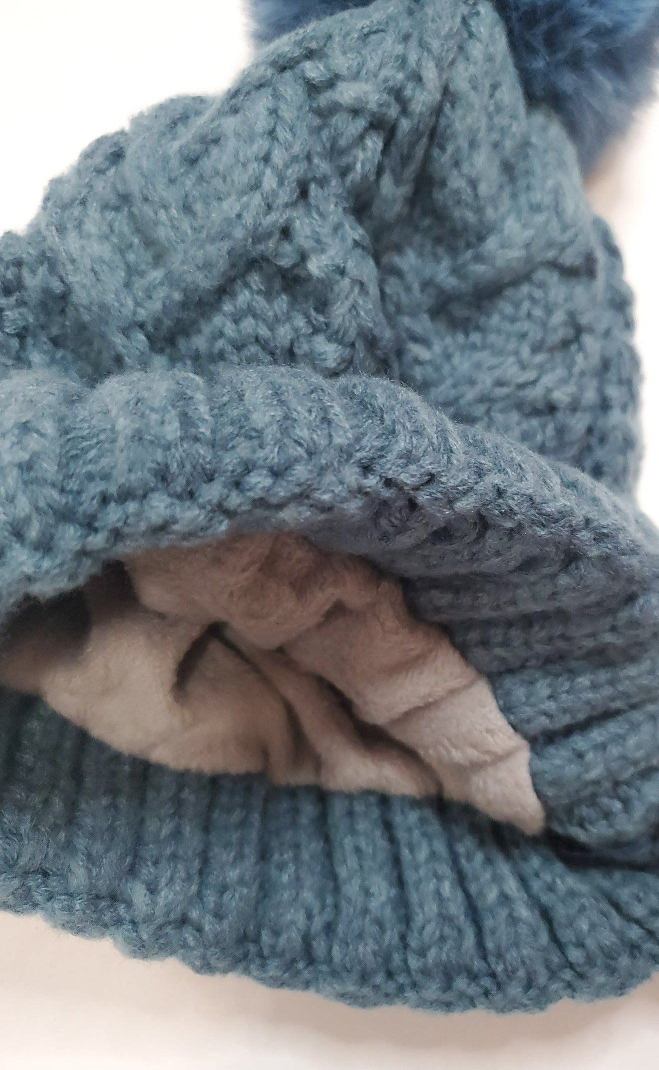 Warm Feels Women's Fleece Thermal Lining Cable Knit Faux Fur Pom Beanie in Blue